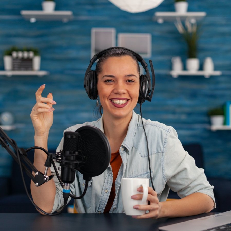 portrait-of-happy-woman-facing-camera-recording-in-home-studio.jpg portrait-of-happy-woman-facing-camera-recording-in-home-studio.jpg